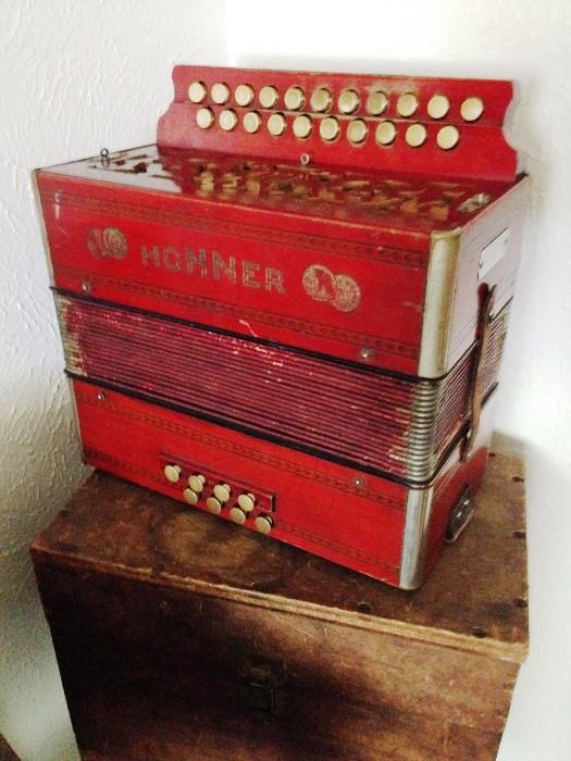 Red wood Hohner squeeze box with wood case