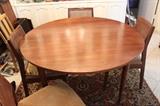 Walnut dining table, four chairs and two leaves.