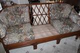Rattan couch with cushion removed.
