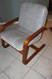 Mid century chair with lather cushion.