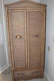 Resin wicker armoire.