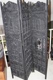 Trifold heavily carved black screen.