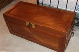 Beautiful teak chest with brass hardware.
