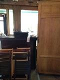 Inside the outside bar. Chairs and Huge armoire style shelves