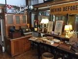 Old cigar boxes, antique record player, boxes, lamps, magazines, and bottles. (The cash register and neon cabaret sign were unfortunately sold as part of the building purchase - sorry!)
