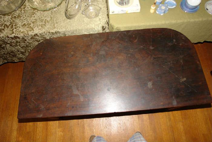 "D" shaped end of table. Could be used as a side table.