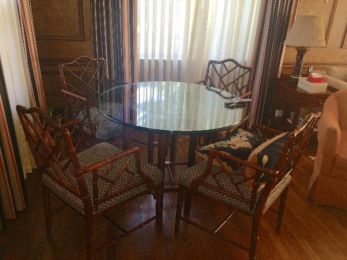 Beautiful round glass table with 4 bamboo chairs