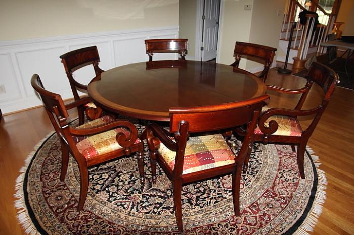 High-end, elegant dining table, custom ordered from Furnitureland South, accompanied by six matching armchairs.  Table has leaves