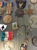 Assorted World War medals and pins