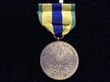 
The Mexican Service Medal was established on December 12, 1917 by War Department General Orders Number 155.

The Yucca plant symbolizes the geographical area of the campaign, and its thorny, spear-like leaves allude to the nature of the raids carried out by Mexican bandits. The mountains in the background represent the type of terrain on which engagements were fought. The wording and dates denote the campaign and the period during which it was conducted. The colors green and yellow are associated with the Aztecs of ancient Mexico. The Aztec standard carried at the battle of Otumba in 1520 consisted of a gold sun surrounded by the green plumes of the quetzal. The blue alludes to the United States Army and also refers to the Rio Grande River that separates in part Mexico from the United States.

One streamer is displayed on the Army flag to represent Mexican Service. The inscription is MEXICO 1916-1917.