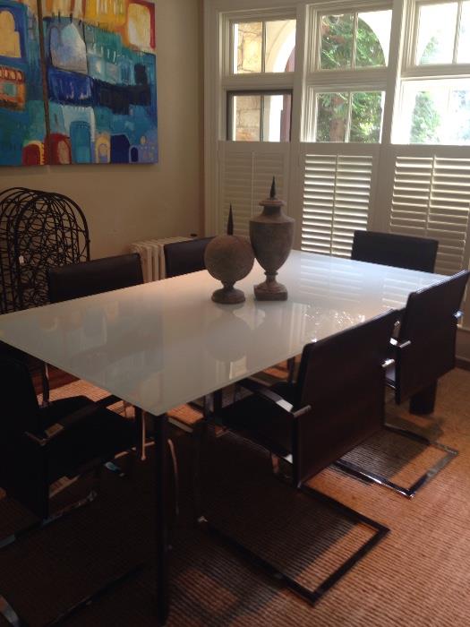 Glass dining table with brown leather legs/coordinating chrome and leather chairs (Theodore's)