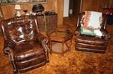 2 vinyl recliner chairs and glass-top end table