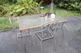 Glass-top patio table and 4 chairs