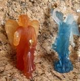 Angels Daum, France sculptures of  angels  with a dove,  pate de verre. One holding a gilt dove and the other holding a gilt flower