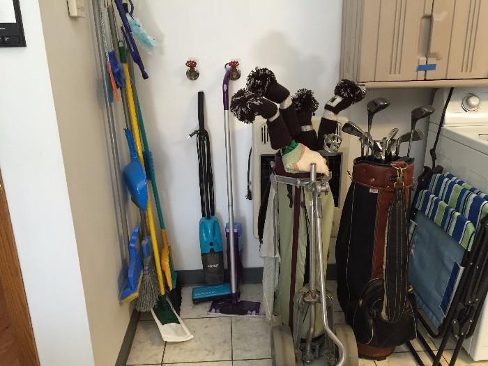 golf clubs brooms and vacuums
