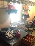 wheels, gardening tools, wooden toolbox, desk with chair