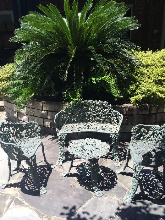   Four piece ornamental iron patio set 