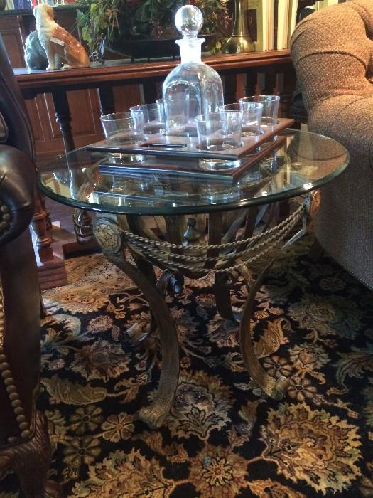    Round glass top side table; decanter set
