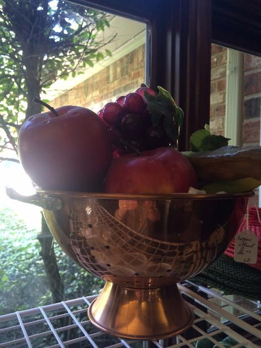   Copper colander filled with fruit & vegetables