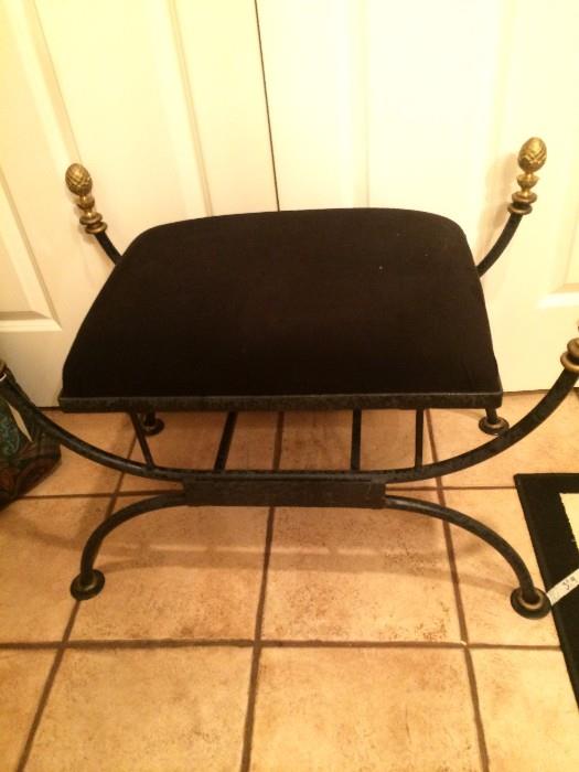      Black cushioned vanity stool