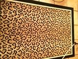    3 feet 9 inches  x  4 feet 7 inches leopard rug