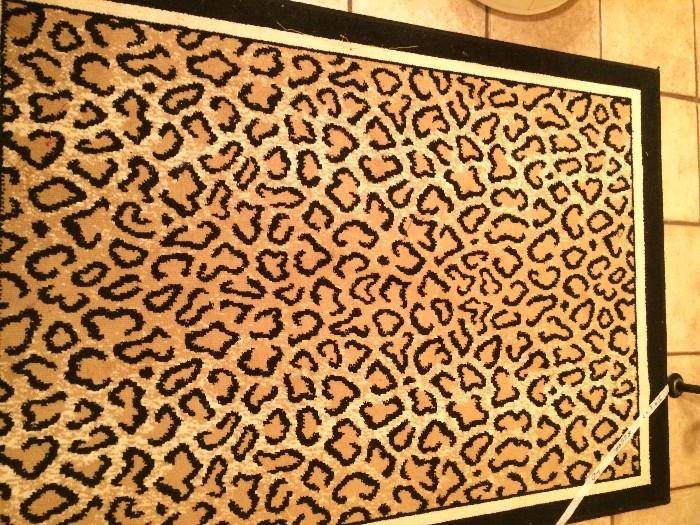    3 feet 9 inches  x  4 feet 7 inches leopard rug