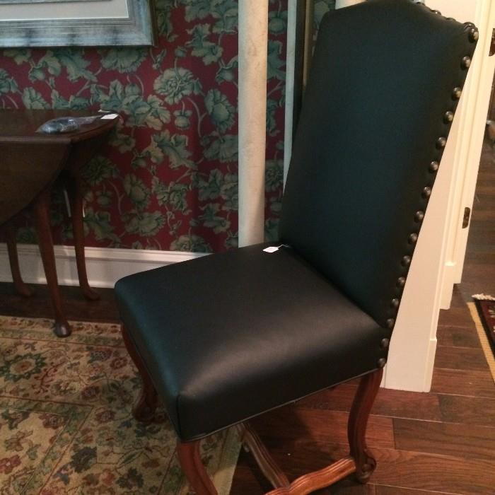  One of two matching black chairs