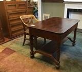 Antique oak library table (with drawer) and vintage oak chair atop a large Egyptian rug.