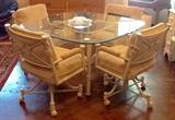 Glass and metal dining set with 4 chairs.