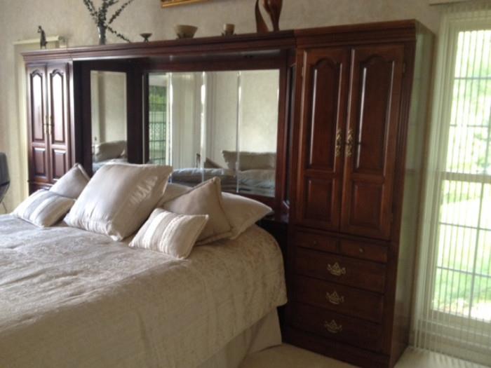 American Drew King Size Bed with Mirrored Back Cherry Dual Cabinet Wall Unit in the Master Bedroom