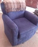 Two blue swivel chairs