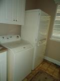 Maytag Atlantis washer and Maytag Neptune DC with upper drying cabinet