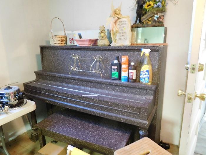 True upright piano - walk out basement to move it out.