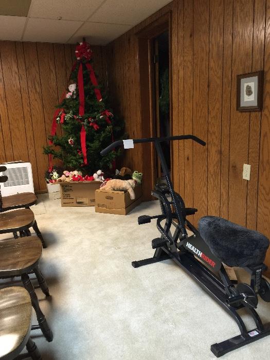 Christmas tree, Christmas decorations, stuffed animals, HealthRider exerciser with weights and instructional video, pine dining chairs.