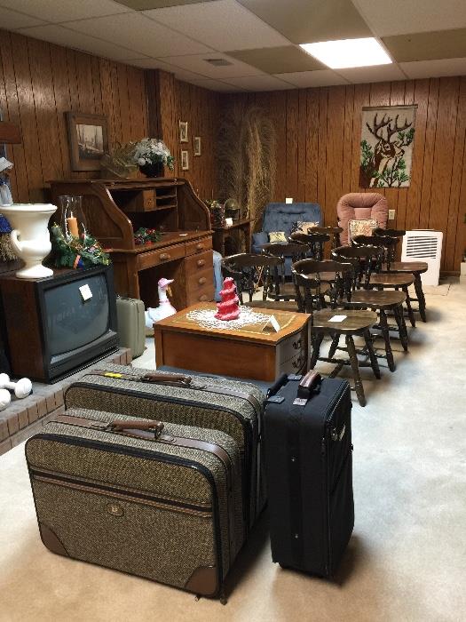 Luggage, 20" picture tube TV, planter, 8 dark pine dining chairs, hooked rug hanging of deer, various prints. Oak roll-top desk, rose colored glider rocker, easy chair, wood side table, leather topped side table are sold.   Dehumidifier not for sale.