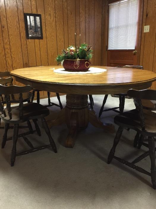Oak dining table- large - round- with one leaf that converts it to oval