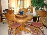 Round oak table & press back chairs - there are 7 chairs