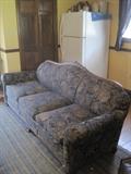 Upholstered sofa with carving on top frame - has matching upholstered chair/ottoman