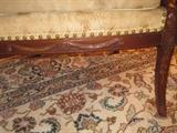 Carving on bottom front and on legs of French bergere chair