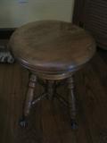 Antique piano stool with claw glass ball feet