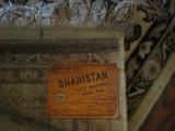 Shahistan label for rug in bedroom upstairs with rice bed