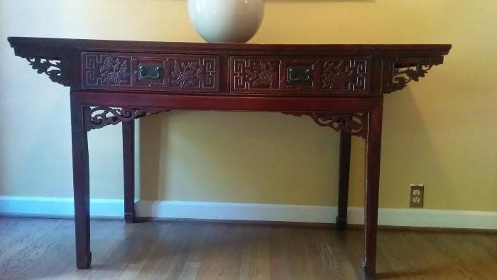 Asian-y mahogany console table.