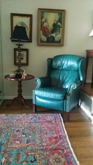 Teal green leather La-Z-Boy recliner, early 19th century religious right oil painting, pair of wooden framed embroidery.                                                                                I had to include another shot of that gorgene Serapi.