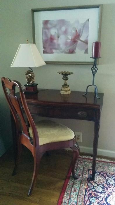 1940's mahogany game table, with a distant relative mahogany chair, original photography by Marilyn Suriani - Orchids - antique brass putti holding a shell, on white marble base; funky monkey lamp.