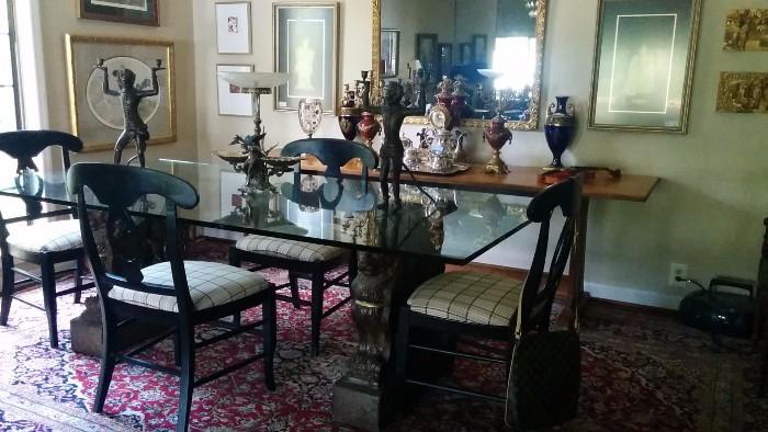 Approximately 10' x13' hand woven Persian Tabriz, topped by an amazingly heavy glass-topped dining table. The bases are a pair of concrete, not the usual terra cotta and the glass is 1" thick. 