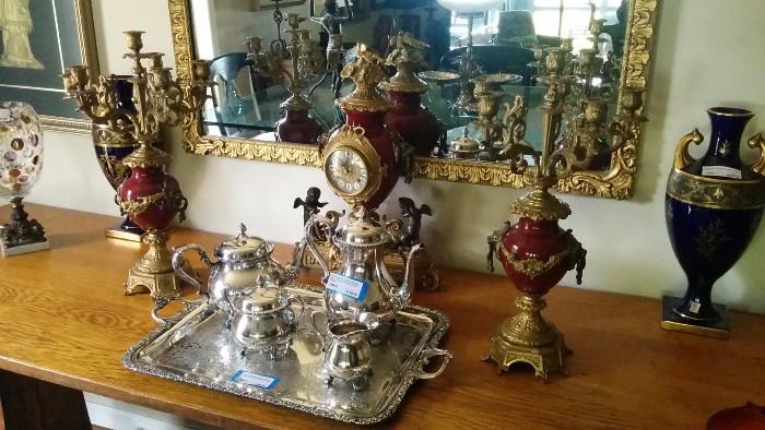 Italian clock set, by the Imperial clock company, a pair of antique, French, Jean Pouyat cobalt blue vases, 1940's gold mirror, freshly polished (by yours truly) silver plated 4 piece tea service, by Wilcox, Du Barry Floral Pattern; silver plated tray, by Wilcox, New Beverly Manor pattern.