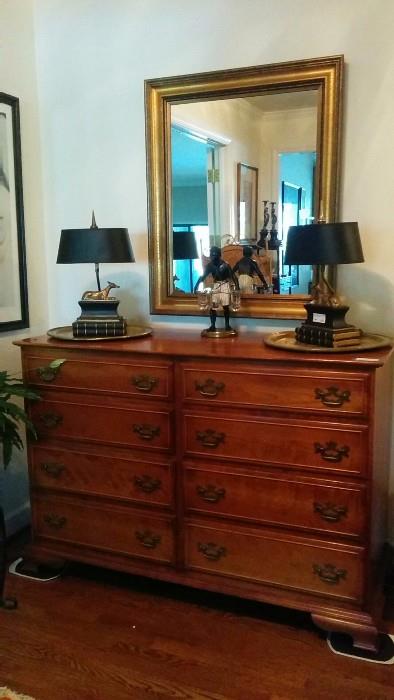 A vintage 8-drawer Stickley "Cherry Valley" chest, with a pair of 1973 vintage Chapman L/R facing brass greyhound table lamps.                                                               The real find is the Petit Choses blackamoor, with three glass vases. 