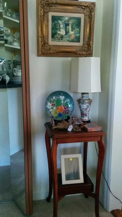 Original oil painting in wooden frame, antique mahogany side table, cute Asian lamp, Mama Quail + 2 quail-ettes on a driftwood branch, wooden humidor below, and a framed pic of something boring. oops, almost forgot the enameled metal tray on plate stand.