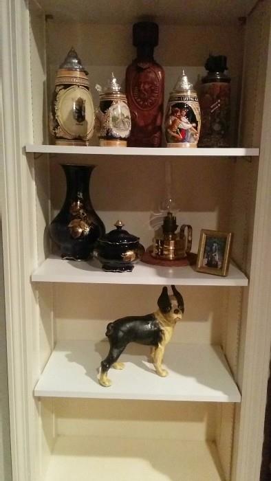 A collection of German beer steins, a heavy French oil lamp and a vintage cast iron Boston Terrier - aww, so cuuuute!