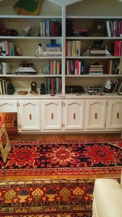 Bookshelves crammed with books, well, what did you expect?!? Oh and there's some vintage cast iron goodies, R.S. Prussia plates, bowls and trays, Roseville, vintage barware, etc.                                                                    Don't miss the Persian Heriz runner!